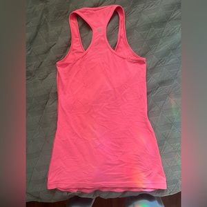 lululemon racerback tank.neonpink no size listed i’m guessing it’s 4-6. no flaws